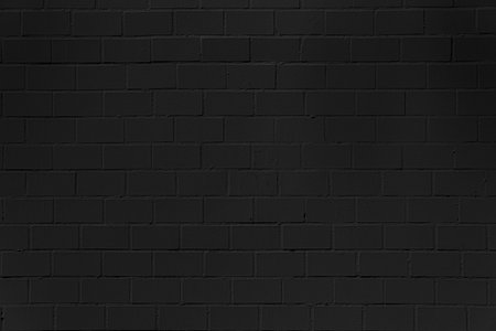The wall is very plain and has no decorations. The bricks are all the same size and shape.の写真素材