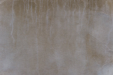 Gray wall with white streaks. The wall is made of concrete.の写真素材