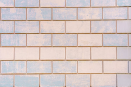 White and blue brick wall. Light and airy atmosphere. Construction neutral background.