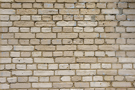 A boring wall of gray silicate bricks. Neutral building background of degradation.の写真素材