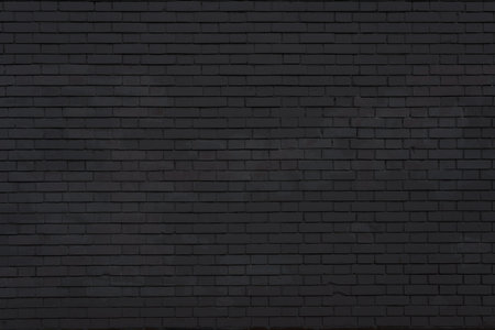 Light black brick wall with textured cracks. Perfect as a background for architectural, urban, or...
