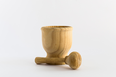 Wooden mortar under white backgroundの写真素材