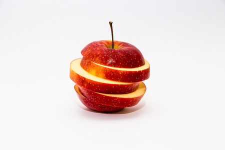 Sweet Red Apple Sliced Isolated on Whiteの写真素材