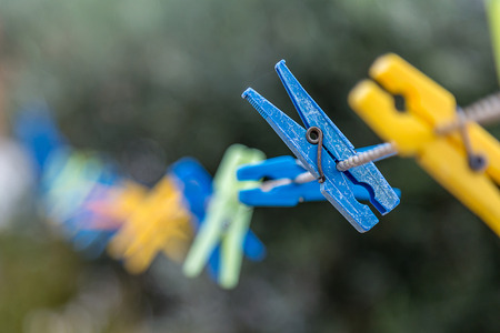 Blurred Plastic Clothes Peg's on a Rope