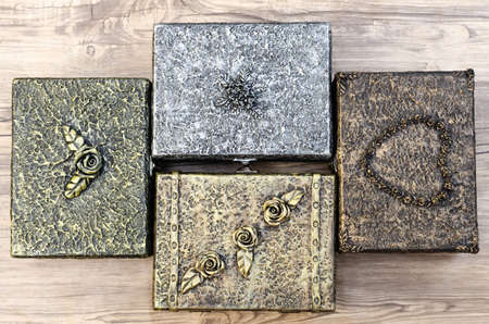 Wooden box decorated like old metal chests.