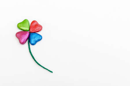 Clover-shaped flower with colorful hearts petals.の写真素材