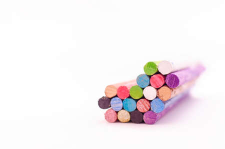 Group of colored sticks or posts forming a heart, on white background. Symbols of love and unity.の写真素材