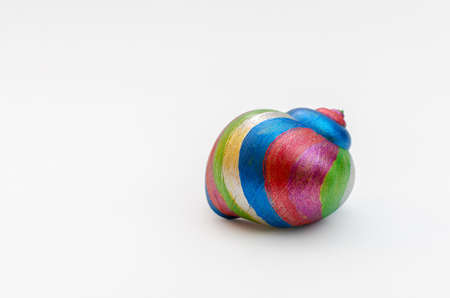 Snail, isolated, painted in multiple colors on white background.の写真素材