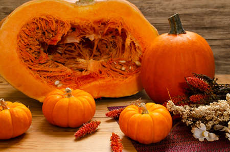 Pumpkins on table with fall decorationの写真素材
