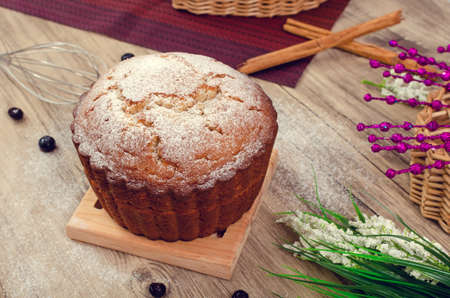 Yogurt pancake filled with red berry compote, on a wooden table decorated with blueberries.の写真素材