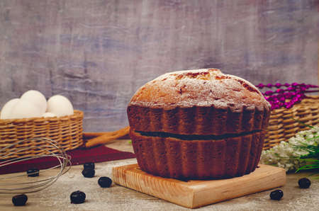 Yogurt pancake filled with red berry compote, on a wooden table decorated with blueberries.の写真素材