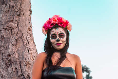 Young Mexican woman made up as a catrina on the occasion of the Day of the Dead.の写真素材