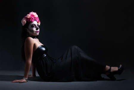 Young Mexican woman made up as a catrina on the occasion of the Day of the Dead.の写真素材