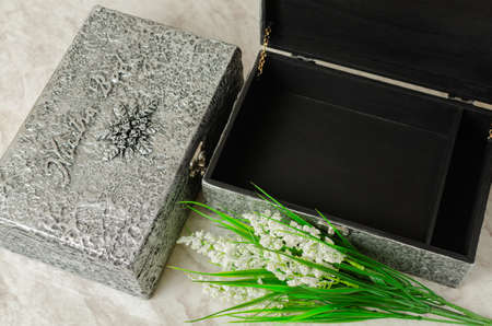 Box decorated as an old chest with silver metallic texture.の写真素材