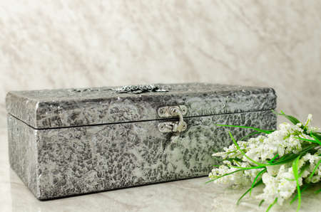 Box decorated as an old chest with silver metallic texture.の写真素材