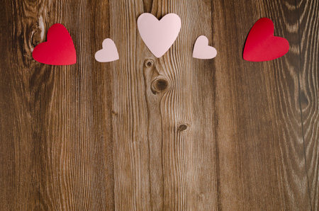 Wooden background with red and white hearts. Background for Valentine's day.の写真素材