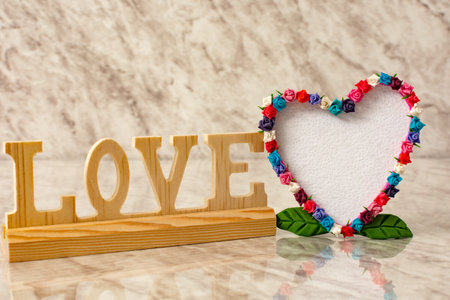 Blank greeting card. Heart-shaped card with flower frame.の写真素材