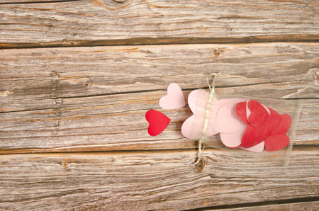 Wooden background with red and white hearts. Background for Valentine's day.の写真素材