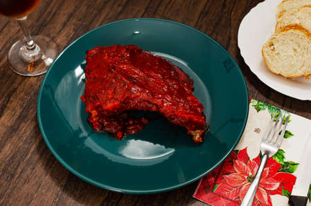 Roasted ribs marinated with barbecue sauce on wooden table.の写真素材
