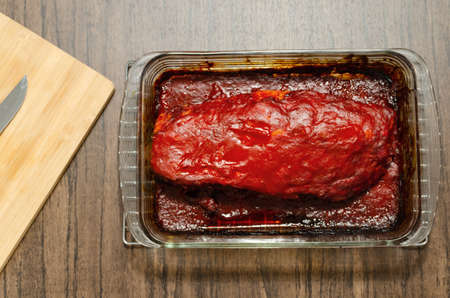 Roasted ribs marinated with barbecue sauce on wooden table.の写真素材