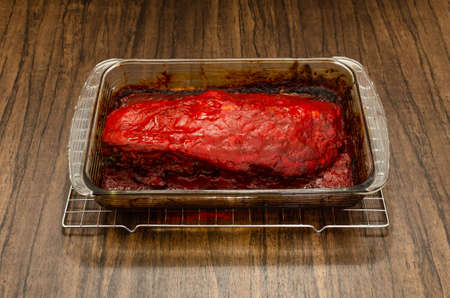 Roasted ribs marinated with barbecue sauce on wooden table.の写真素材