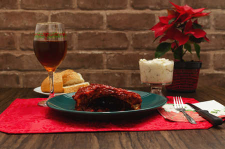 Roasted ribs marinated with barbecue sauce on wooden table.の写真素材