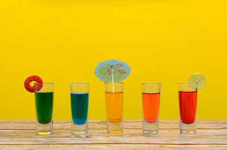 Colorful cocktails on wooden table.の写真素材