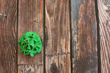 Homemade colorful cupcakes on wooden table.の写真素材