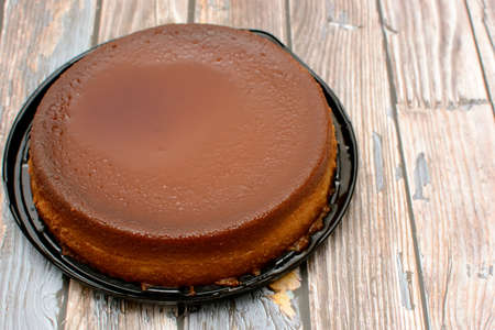 Homemade bread pudding on wooden table.の写真素材
