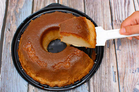 Homemade bread pudding on wooden table.の写真素材