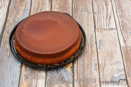 Homemade bread pudding on wooden table.の写真素材
