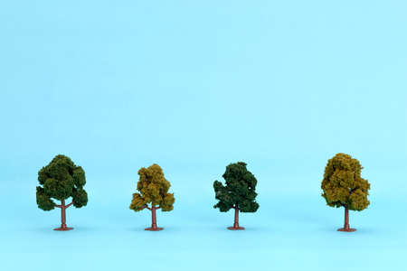 Artificial tree to scale on a blue background. Isolated tree.の写真素材