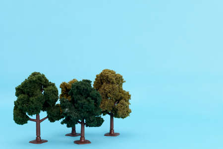 Artificial tree to scale on a blue background. Isolated tree.の写真素材