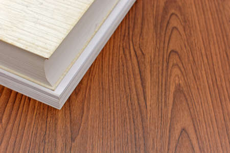 Books and sheets on wooden desk.の写真素材