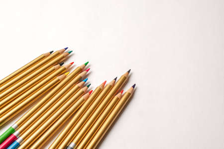 Colored pencils disordered on white background. Group of pencils of different colors.の写真素材