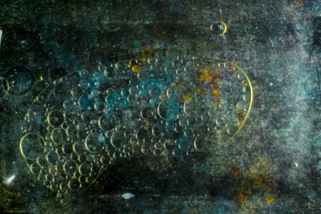 Abstract colorful background. Mixture of water and oil on colored background.
