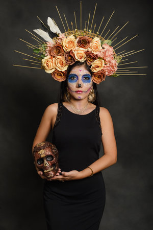 Holy death. Portrait of a woman with sugar skull makeup. Halloween make-up. Portrait of Calavera Catrinaの写真素材