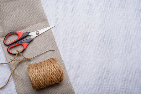 Instruments and materials on textile texture. Concept of handicrafts.の写真素材