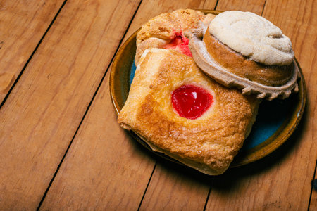 Concha and other sweet breads on wooden table. Typical Mexican desserts.の写真素材