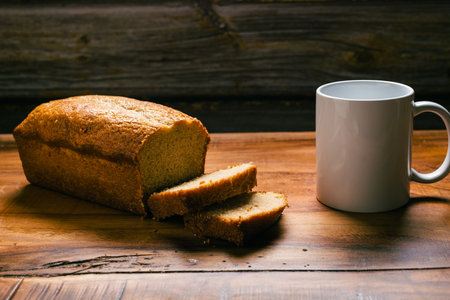 Homemade sponge cake on wooden table. Sliced soft pound cake.の写真素材