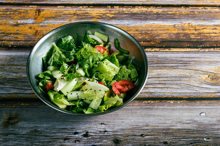 Vegetable salad on wooden table. Healthy food.の写真素材