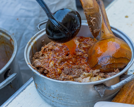 Birria de carnero, typical dish from Jalisco, Mexico. Ram meat in an aluminum pot.