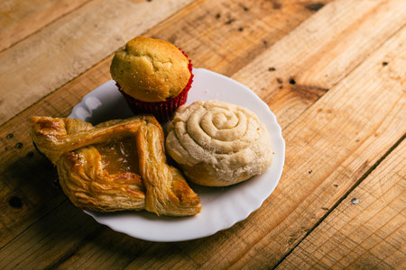 Concha and other sweet breads on wooden table. Typical Mexican desserts.の写真素材