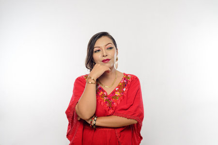 Woman with an attitude of indifference. White background.の写真素材