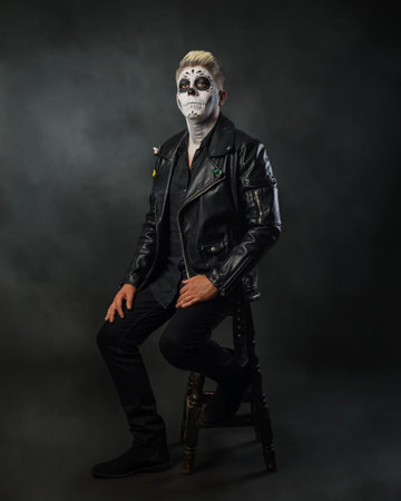 Man with catrin makeup wearing leather jacket. Studio portrait, Day of the dead.の写真素材