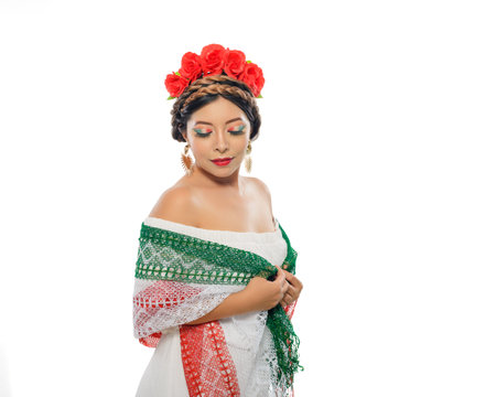 Mexican woman with scarf and tricolor make-up wearing white dress. Woman with scarf and makeup with the colors of the Mexican flag. White background.の写真素材