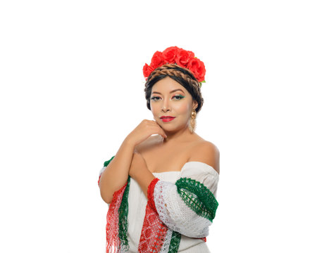 Mexican woman with scarf and tricolor make-up wearing white dress. Woman with scarf and makeup with the colors of the Mexican flag. White background.の写真素材