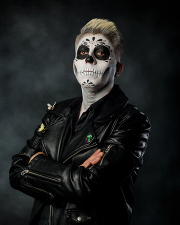 Man with catrin makeup wearing leather jacket. Studio portrait, Day of the dead.の写真素材
