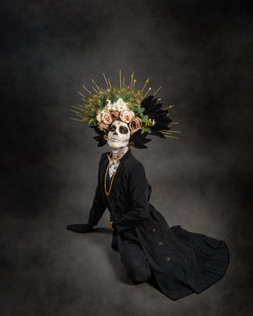 Studio portrait of Drag Queen catrin. Catrin dressed in black with flower crown. Makeup for halloween or day of the dead.の写真素材