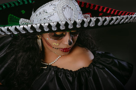 Catrina wearing a mariachi hat with the colors of the Mexican flag. Day of the dead celebration.の写真素材